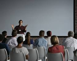 person giving a presentation at a conferenceの画像