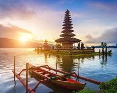 Image of Bali's lush rice terraces, temples, and a dramatic sunset over the ocean