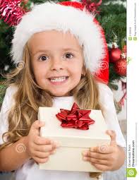 Ecstatic happy girl with christmas present - ecstatic-happy-girl-christmas-present-21836628