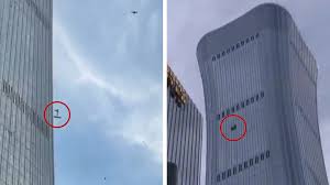 China: Debris falls after plane hits Beijing's tallest building