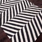 Black and white herringbone rug