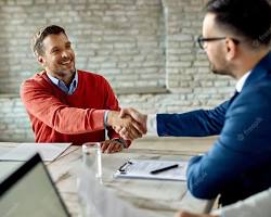 Image of Person shaking hands with interviewer