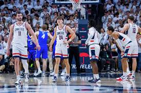 UConn basketball team celebrating a victory