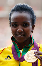 Gold medalist Tirunesh Dibaba of Ethiopia poses on the podium during the medal ceremony for the Women&#39;s 10,000m on Day 8 of the London 2012 Olympic Games at ... - Tirunesh%2BDibaba%2BOlympics%2BDay%2B8%2BAthletics%2BaxTp0e6nruRl