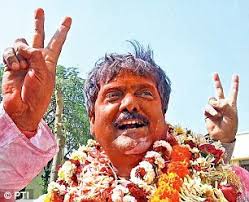 Forward Bloc candidate Dipak Chatterjee celebrates his victory - article-2286196-185BB254000005DC-614_306x248