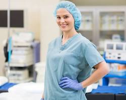 Image of woman healthcare worker smiling and wearing a stylish scrub cap