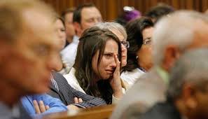 Aimee Pistorius, sister of South African Olympic and Paralympic sprinter Oscar Pistorius, cries as he gives evidence during his trial. - aimee_pistorius_sister_of_south_african_olympic_an_53444a69cf