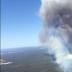 Stranded Perth man charged over bushfire