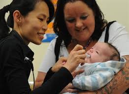 Dunedin Hospital paediatric doctor Mee-Yew Chen (left) demonstrates how a new rotavirus vaccine is orally administered, with Port Chalmers mother Leah ... - dunedin_hospital_paediatric_doctor_mee_yew_chen_le_4f6ec287c7