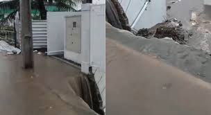 Canal transborda em Goiana, derruba parte de muro de escola e invade casas