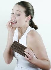 Diet Helps Hypertension: U of California. Eating a small, 1.6-ounce bar of dark chocolate every day is good for you, according to Mary Engler ... - womanwithchocolatebarwondering