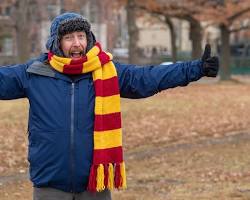Image of person wearing a winter coat, hat, gloves, and scarf