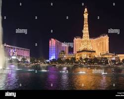 Image of Paris Las Vegas Eiffel Tower at night with Bellagio Fountains in foreground