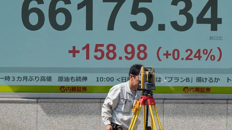 World shares decline as bond market pressure persists, Iran's rial sinks to record low against dollar; investors await Jackson Hole signals