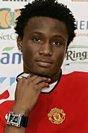 John Mikel Obi. Spot the difference: John Mikel Obi was paraded in United shirt before he changed his mind and signed for Chelsea - article-1076269-029043610000044D-935_306x459