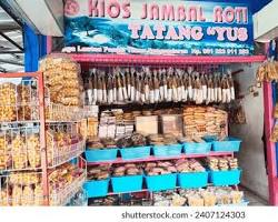 Gambar Ikan Asin Jambal Roti at a souvenir shop in Solo, with various other traditional snacks.