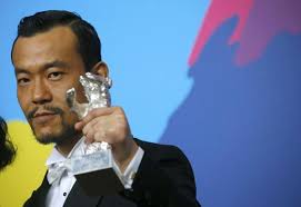 Actor Liao Fan, poses with his Silver Bear for Best Actor in the film &quot;Bai Ri Yan Huo&quot; (Black Coal, Thin Ice) during a news conference after the awards ... - 001ec9790963146ba3c118