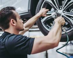 Mechanic servicing a car