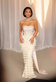 Kim Kardashian Wows in a Plunging Optical Illusion Dress With a Sheer Skirt and Floor-Length Rhinestone Fringe