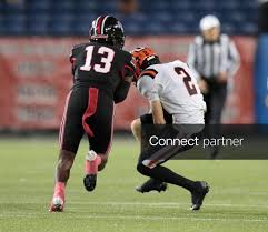 Licensable picture: Hoover's Ian Dennis (2) catches the ball and is hit immediately by McKinley's Desmond Parnell during the teams' Federal League