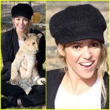 Shakira gets playful with a lion cub at The Lion Park in Johannesburg, South Africa on Thursday (July 8). The 33-year-old Colombian singer played with a ... - shakira-lion-share-love