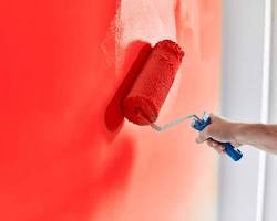 Image of homeowner and painter discussing paint colors and finishes