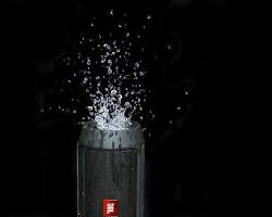 Image of speaker being splashed with water