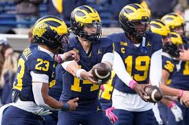 Michigan quarterback Tommy Carr (14) warms up with running back Jordan Marshall (23) ahead of the game between Michigan and Indiana at Michigan Stadium in Ann Arbor on Saturday, Oct. 24, 2026.