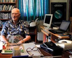 Image of Arthur C. Clarke writing at his desk