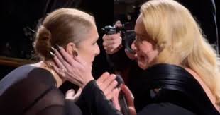 Adele and Celine Dion tear up during emotional embrace as fans go wild