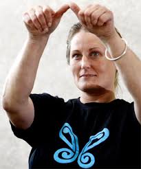 HAND TALK: Fleur Daniel, the region&#39;s only qualified interpreter for the deaf, signs the word Taranaki during New Zealand Sign Language week. - 4969144