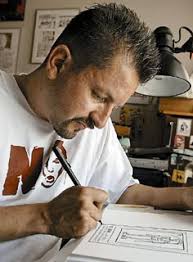 Lalo Alcaraz works on his comic strip &quot;La Cucaracha.&quot; - lalo-alcaraz