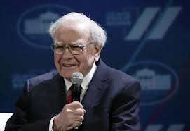 Warren Buffett stock market warning strategy 2026 with investor reviewing market charts