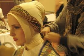 Not just a veil: Muslim fashion brand Up2date designer Lia Triana puts an ikat accessory on a model&#39;s veiled head, at the Gala dinner and Muslim fashion ... - up%2520p21-a_38.img_assist_custom-400x267