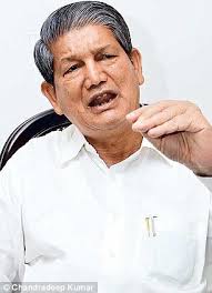 Uttarakhand CM Harish Rawat has removed Amrita Rawat (right) from his Cabinet. Satpal Maharaj had resigned from the party in March to join the BJP. - article-2633064-1E053FBA00000578-224_306x423