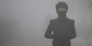 Image result for This picture from January 2013 shows two men walking in Beijing's dense smog. (AFP/Getty Images)