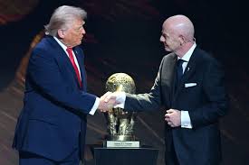 FIFA President Gianni Infantino holding the FIFA Peace Prize trophy