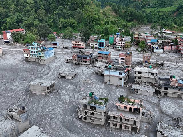 Flash floods devastate Nepal as experts warn climate change could make them routine; UK pledges £5M in aid