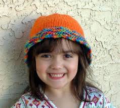 Designed by Barbara Breiter. Ruffle Hat For Kids Knitting Pattern. The ruffle brim on this cute hat for kids is knit in garter stitch. - kidshatice