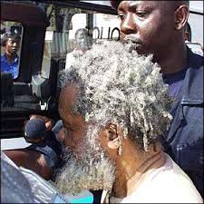 Foday Sankoh outside the court in Freetown. Foday Sankoh looked thin and weak - _1871085_sankoh1300300