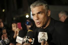 Yair Lapid, leader of the Yesh Atid party, gives a statement outside his home in Tel Aviv Jan. 23 after his party dealt Israeli Prime Minster Benjamin ... - 0123-Yair-Lapid_full_600