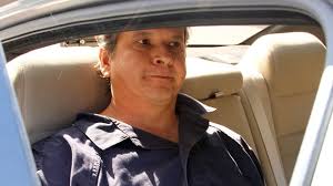 Marco Antonio Delgado sits inside a car outside of the El Paso County Jail on Monday, Nov. 5, 2012 in El Paso, Texas. (AP Photo/Juan Carlos Llorca) - image