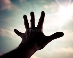 Image of sculpture of a hand reaching up towards the sky