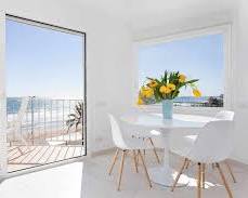 modern apartment interior bright sun terrace sea view Sitges Mediterranean, généré par IA