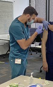 Michigan's chief medical executive says the vaccine 'reduces severe complications' of the flu, including hospitalization.