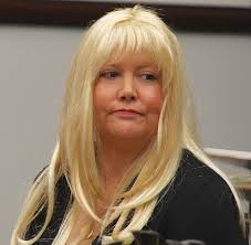 Julie Harper. She allegedly shot him in the back while in the master bedroom of their Carlsbad home — while their children were watching TV downstairs. - Julie_Harper_w_striking_blonde_wig_Nov_22_2013._Photo_Eva_t670_1_t670