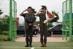 Two BTS megastars released from South Korea military