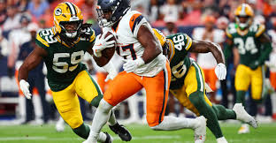 Denver Broncos game play against the Packers