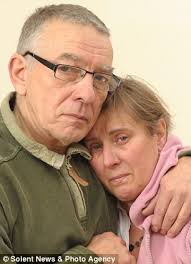 Praying: Parents David and Teresa Yeates, left, and boyfriend Greg Reardon are distraught following the disappearance of Jo Yeates - article-1340586-0C8FE310000005DC-60_306x423