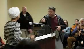 Man douses Ilhan Omar with unknown substance at town hall in Minneapolis